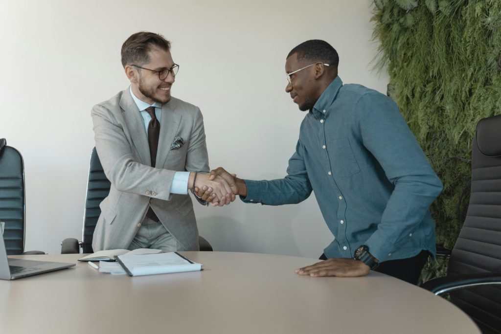 Interview to men shaking hands